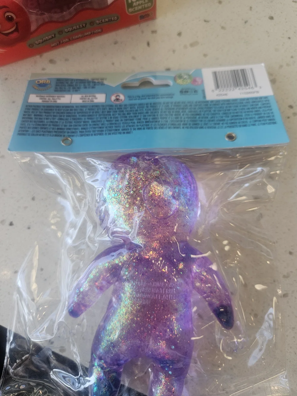 Onesies Purple Glitter Squeeze Baby Toy